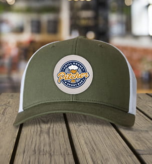 Green hat with beige saddle patch